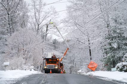 fixing power lines after a snow storm